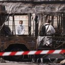 epa10718760 French Scientific Police inspect the area after buses were burned overnight at a public transport site in Aubervilliers, near Paris, France, 30 June 2023. Violence broke out all over France after police fatally shot Nael, a 17-year-old, during a traffic stop in Nanterre on 27 June. EPA/YOAN VALAT