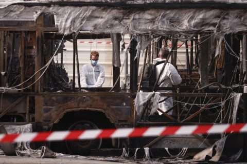 epa10718760 French Scientific Police inspect the area after buses were burned overnight at a public transport site in Aubervilliers, near Paris, France, 30 June 2023. Violence broke out all over France after police fatally shot Nael, a 17-year-old, during a traffic stop in Nanterre on 27 June. EPA/YOAN VALAT