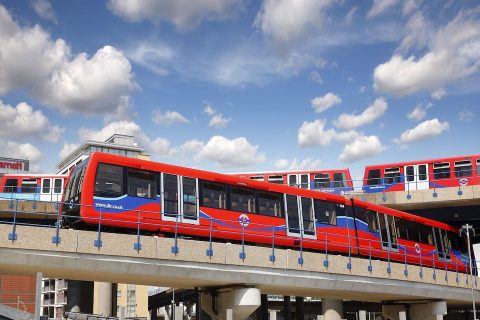 DLR trains passing each other on different levels of a flyover