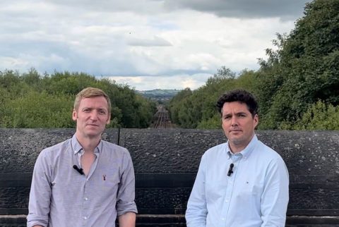 Portrait of Lee Rowley Mp and Huw Merriman MP who is also rail minister in the `UK government on a bridge overlooking the tracks of the Barrow Hill Line
