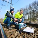 Infrabel workers installing safety devices on Belgian rail tracks