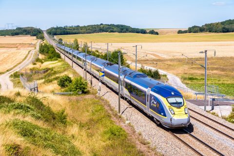 Baron, France - July 29, 2020: A Eurostar e320 high speed train is driving from Paris to London on the LGV Nord, the North European high speed railway line, in the french countryside.