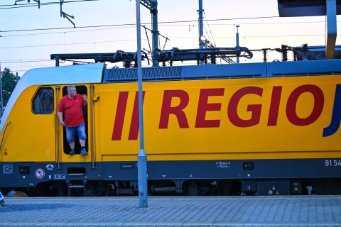 RegioJet train with the train driver stepping out of the cabin