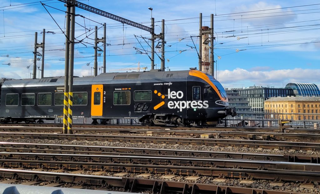 Leo Express train with the text 'powered by Renfe' below the logo on the train