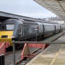 A shot from behind the buffers looking at a GWR HST "Castle Class" train set at Plymouth station