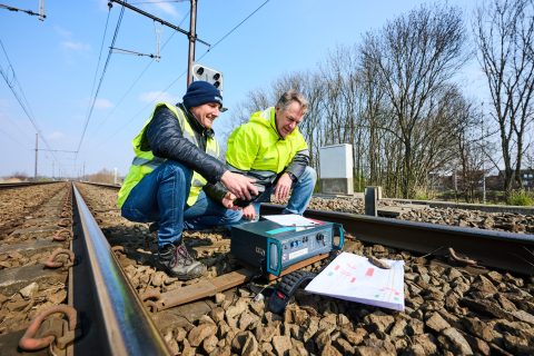 Infrabel workers installing safety devices on Belgian rail tracks