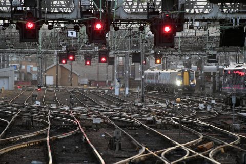 Red signals over track at a major junction