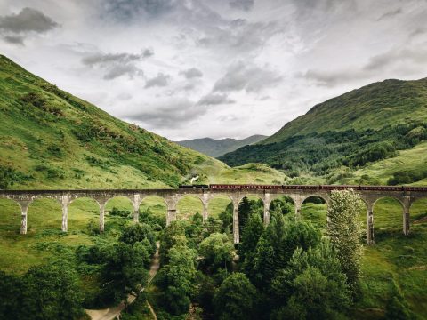 The Glenfinnan Viaduct, located in Scotland, is renowned for its role as a significant landmark along the route taken by the Hogwarts Express in the Harry Potter films. 