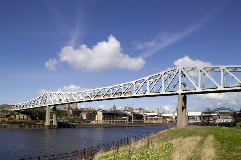 Tyne and Wear Metro train on QEII bridge over the River Tyne with Newcastle city in background