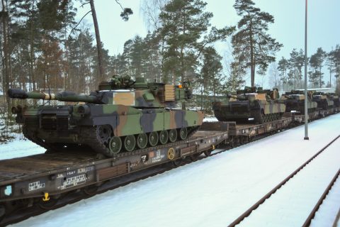 US army tanks on railway in Germany snow.